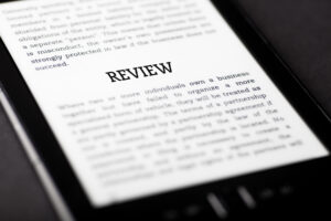 A hackneyed attempt to illustrate the idea of reader reviews via an ebook reader with the word "Review: