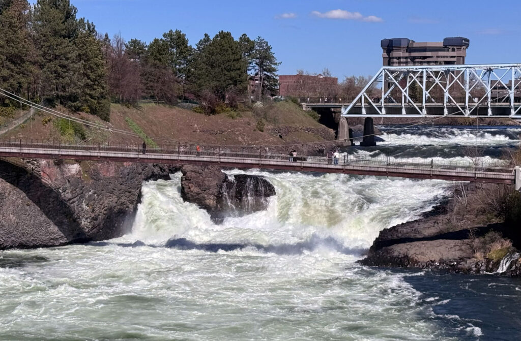 A photo showing the Spokane Falls on the Spokane River in the middle of Spokane.